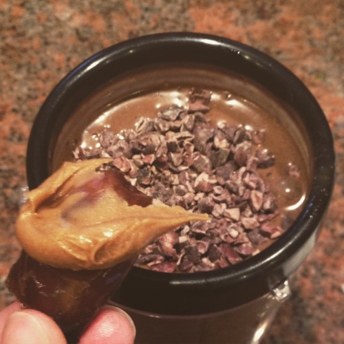 my obsession: dates with peanut butter (and a protein shake behind it)